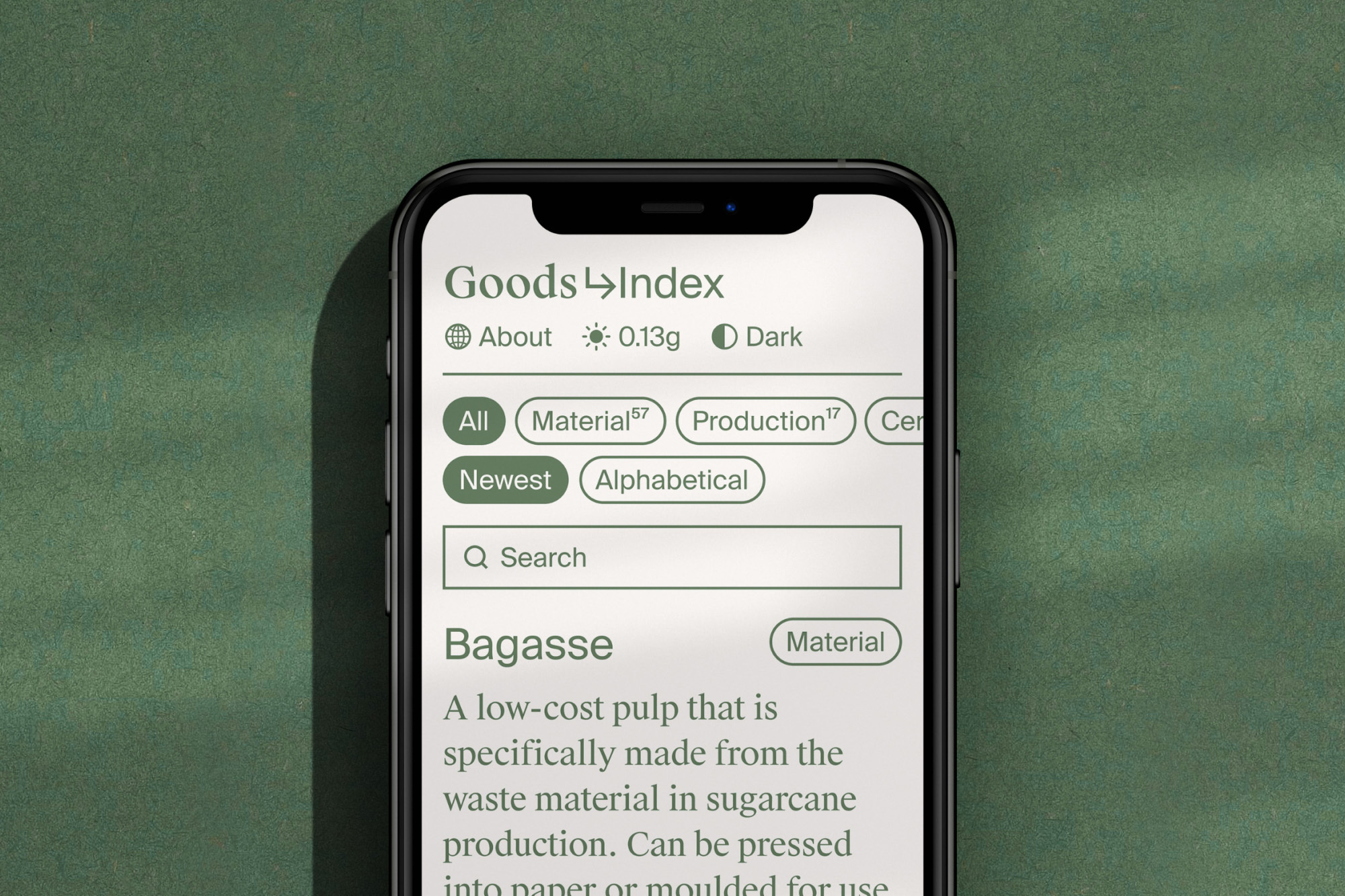 Goods Index application interface displayed on a smartphone screen, featuring a search bar and material information, on a green background.