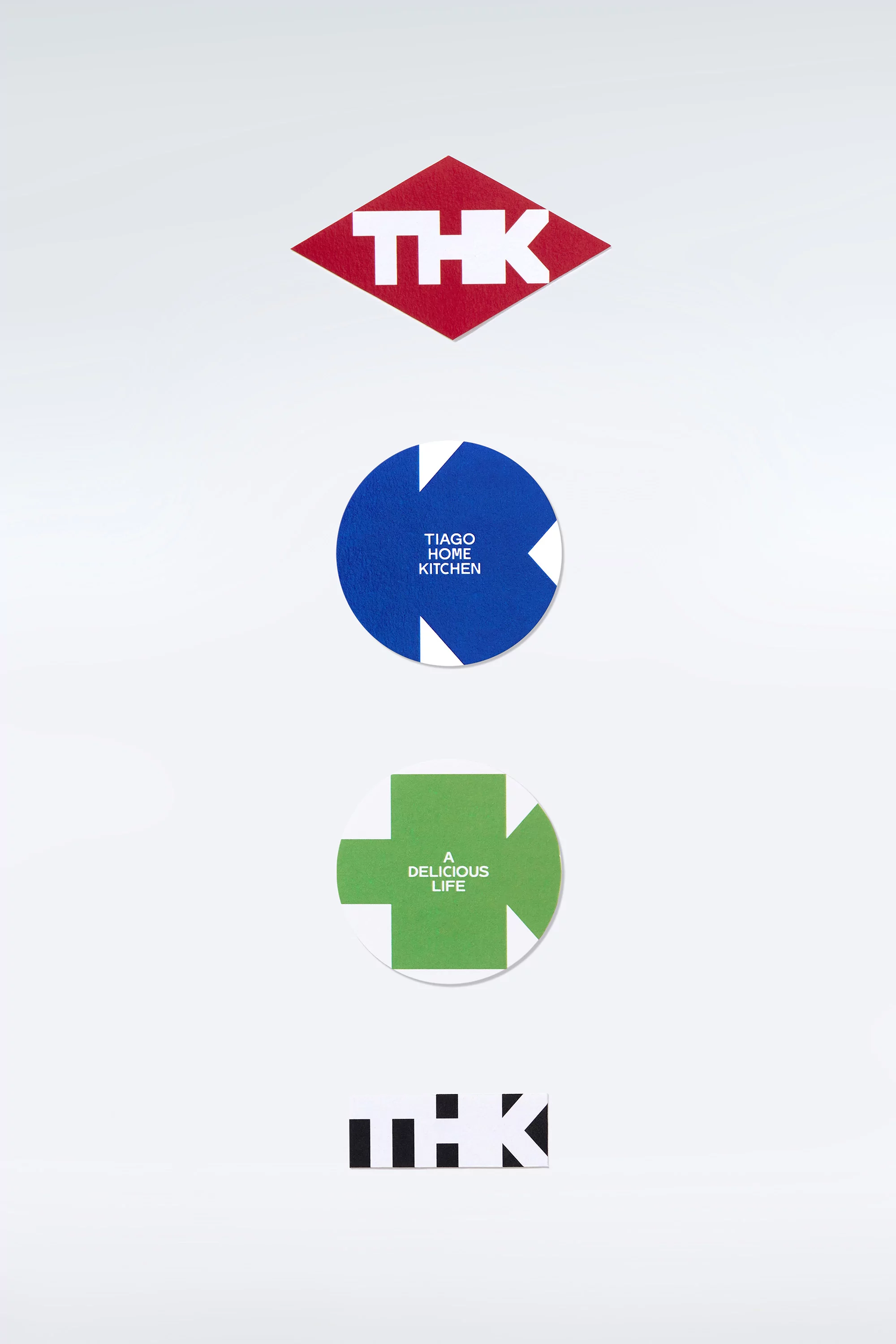 Graphic logos in red, blue, and green with text on a white background, suitable for branding or company identity materials.