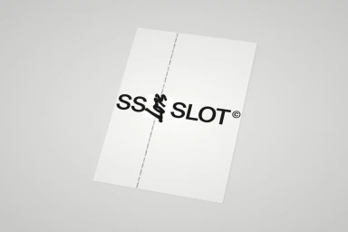 A white rectangular paper sheet featuring bold black typography reading SS SLOT with a copyright symbol against a neutral grey background.