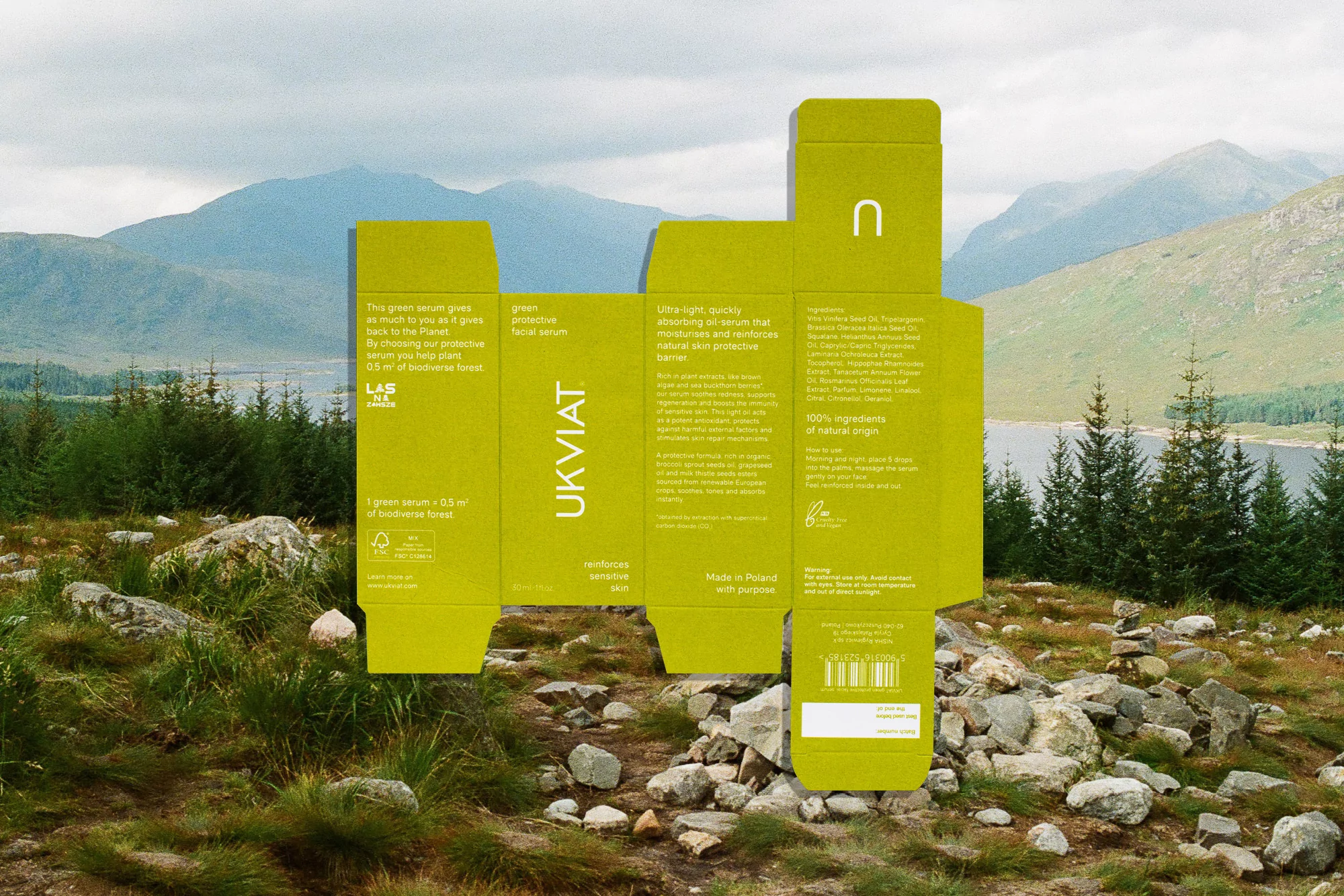 UKVIAT skincare serum box in a natural setting with mountains and trees. Green packaging with product details and logo.