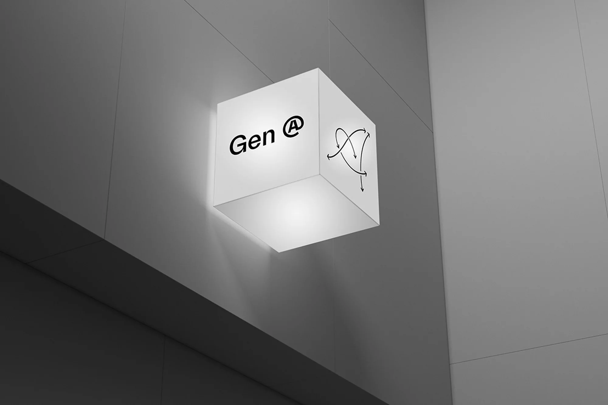 Illuminated cube sign hanging on a gray wall featuring 'Gen @' logo and abstract arrow designs, emphasizing modern office or brand identity.