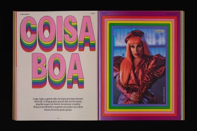 Open magazine spread for Netflix Brasil showing bold pink typography on the left and a portrait of a person in a red outfit on the right.