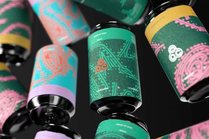Multiple colorful cans with unique designs and dark lids on a dark background, creating a visually appealing and modern product display.