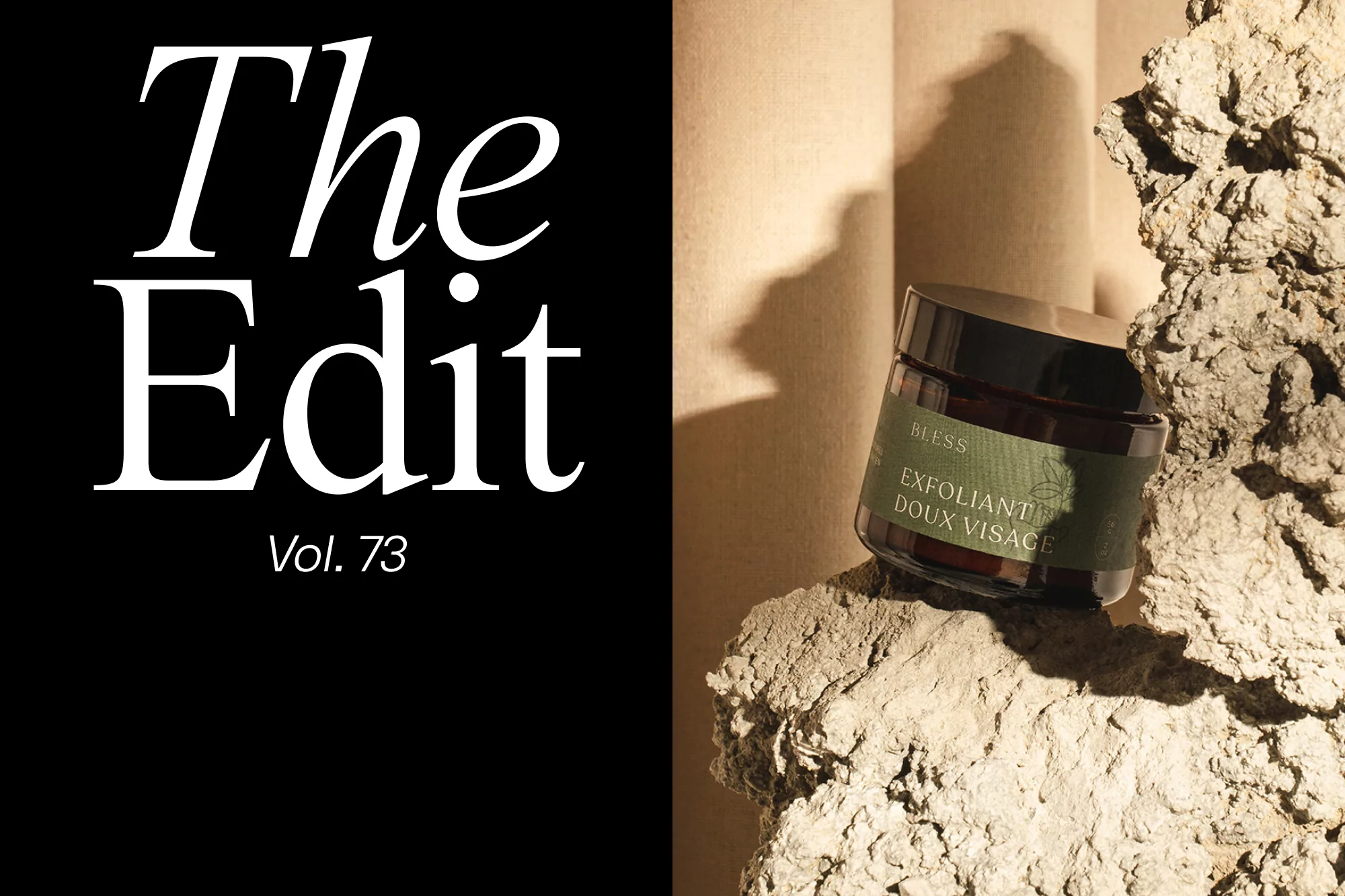 A jar of face cream sits atop a rock, next to black text, showcasing the product's packaging and placement in a natural setting.