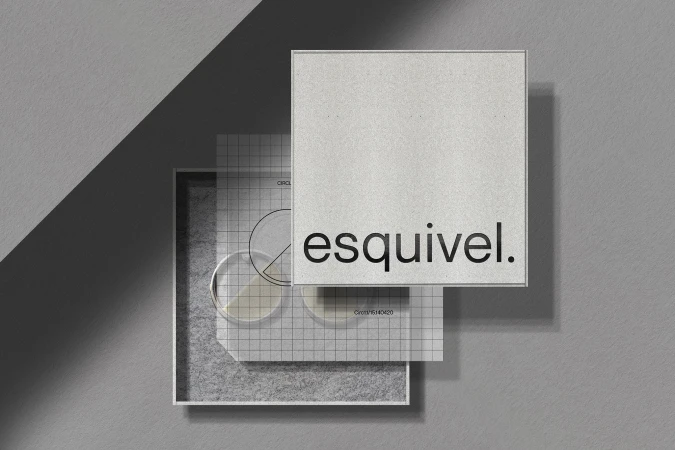 Elevated view of a box packaging mockup, showcasing a square product box with the brand name 'esquivel.' and a grid patterned insert.