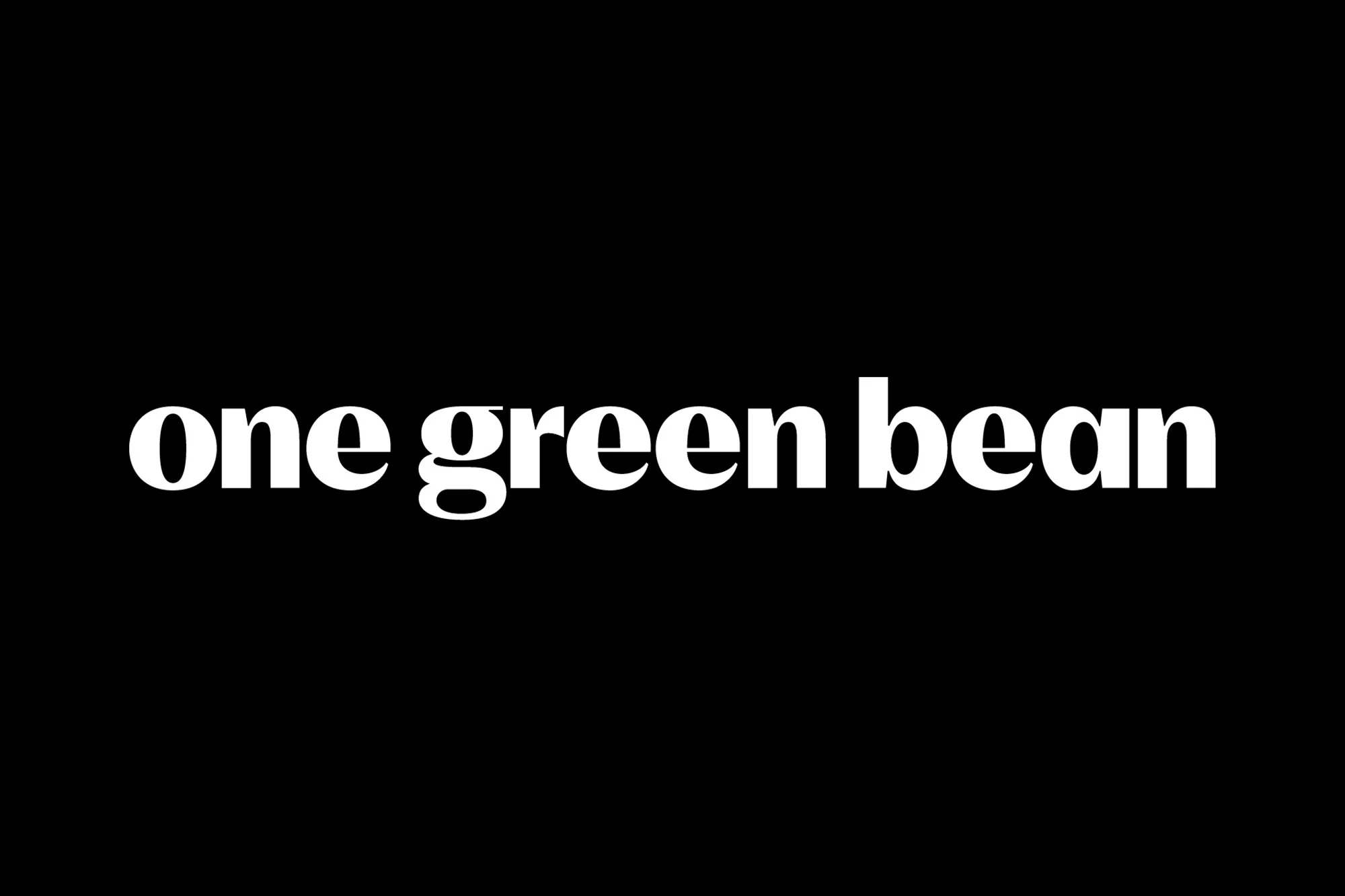 Graphic text on a black background reads 'one green bean' in a bold, serif typeface. The composition is clean and centered.