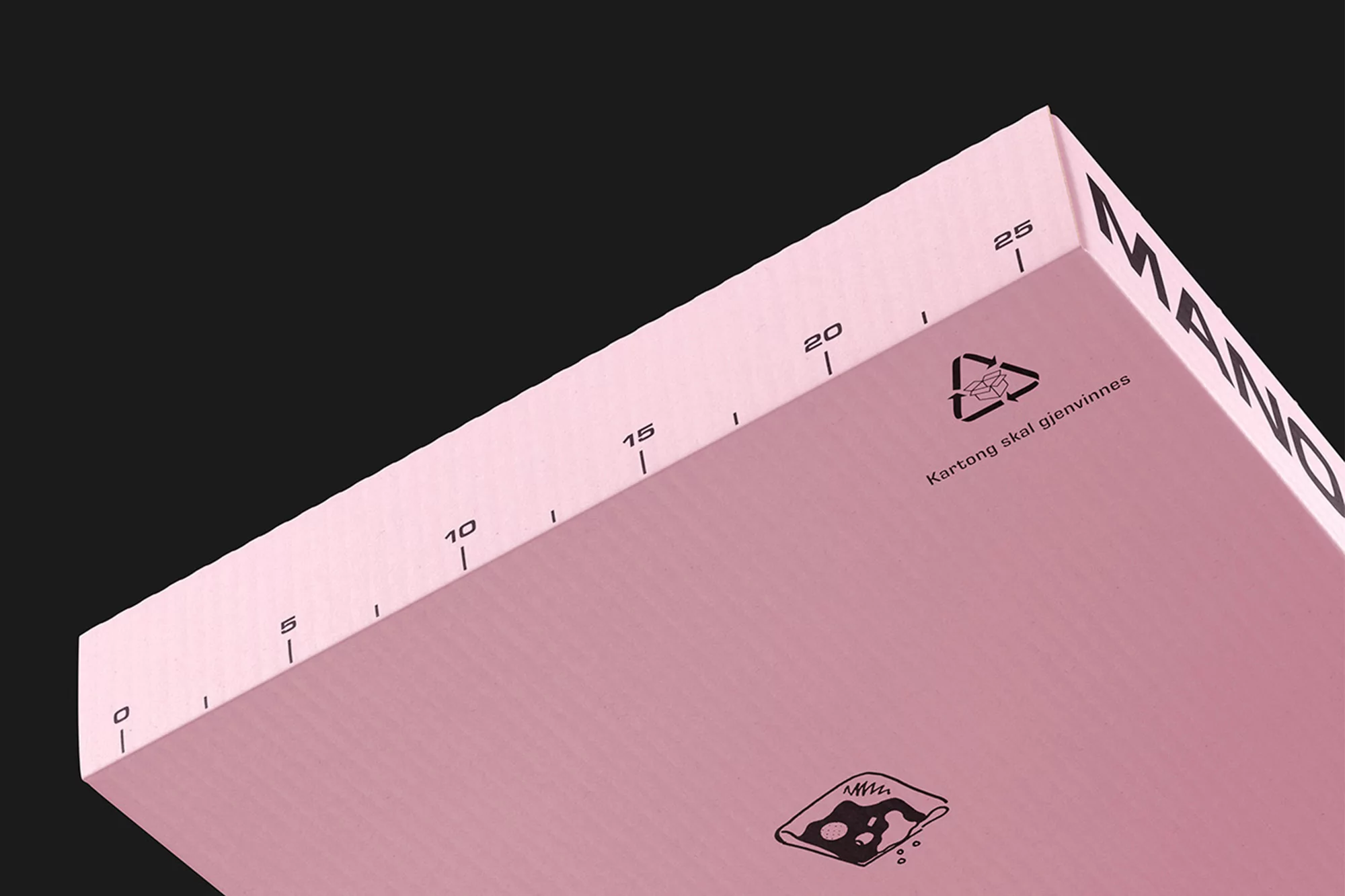 Close-up view of a pink box, angled perspective, featuring black measurement lines and recycling symbols against a black background.