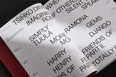 Open magazine pages featuring bold typography and black text layout on white paper for FEW Magazine brand identity