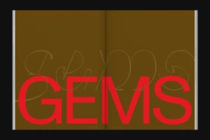 Open magazine spread featuring large red typography spelling GEMS over a solid brown background with fine script overlay.
