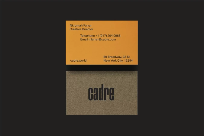 Two business cards arranged on a black background. The top card is orange, while the lower card is light brown with 'cadre' printed.