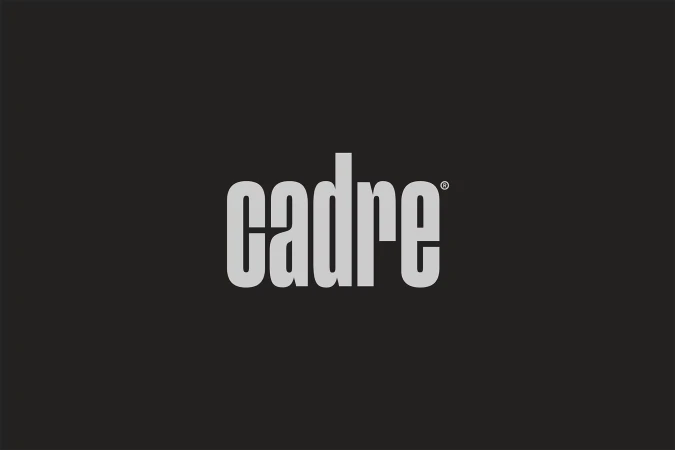 Cadre brand identity logotype centered in light grey against a dark solid background