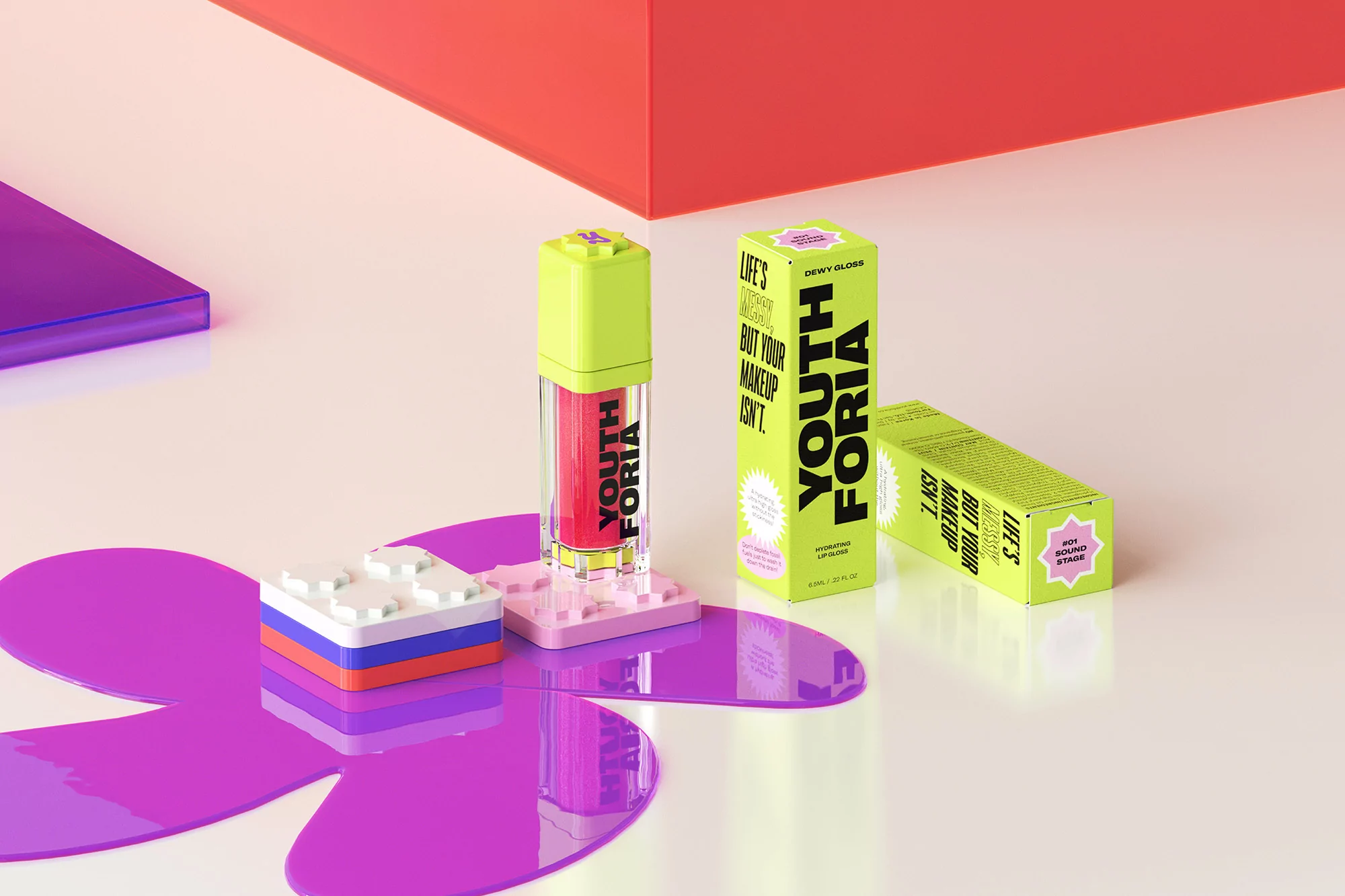 Youthforia lip gloss and product packaging, positioned with a Lego brick and platform, against a graduated red, pink, and white backdrop.