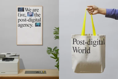 Split view showing a framed typographic poster on a grey wall and a hand holding a canvas tote bag with Post-digital World text