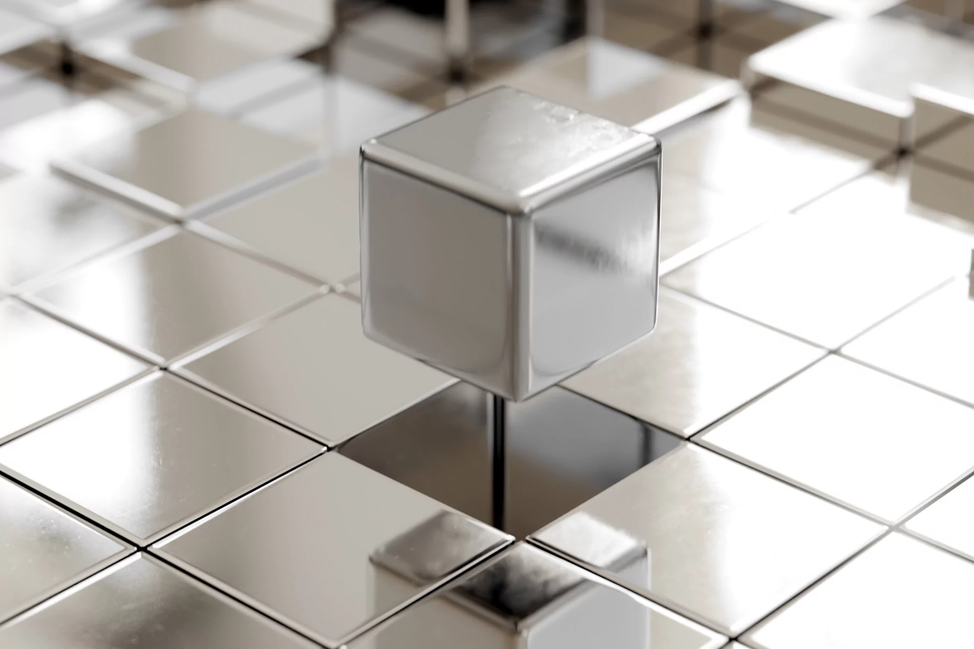 A metallic cube floats above a checkered grid of gray and silver squares, reflecting light in a sleek, modern, and abstract design.