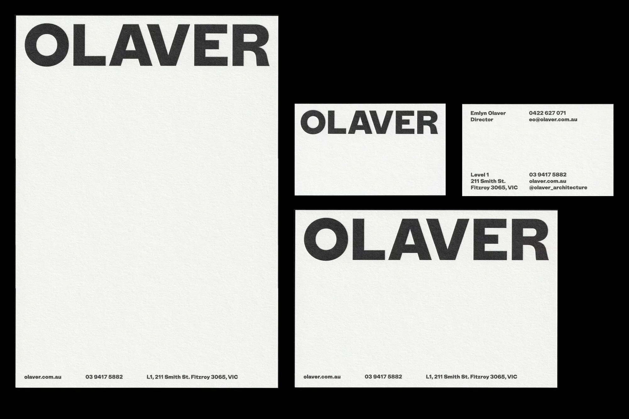 Stationery set mockup features letterhead, business cards with the brand name OLAVER in black against a clean, white background.