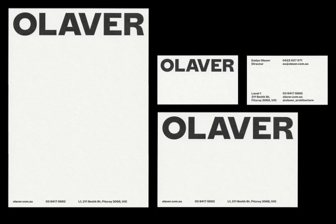 Stationery set mockup features letterhead, business cards with the brand name OLAVER in black against a clean, white background.