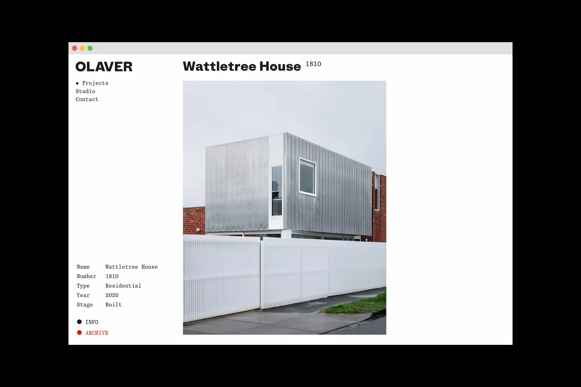 Modern residential architecture featuring a metal-clad house with a white fence against a cloudy sky, seen on a website layout.