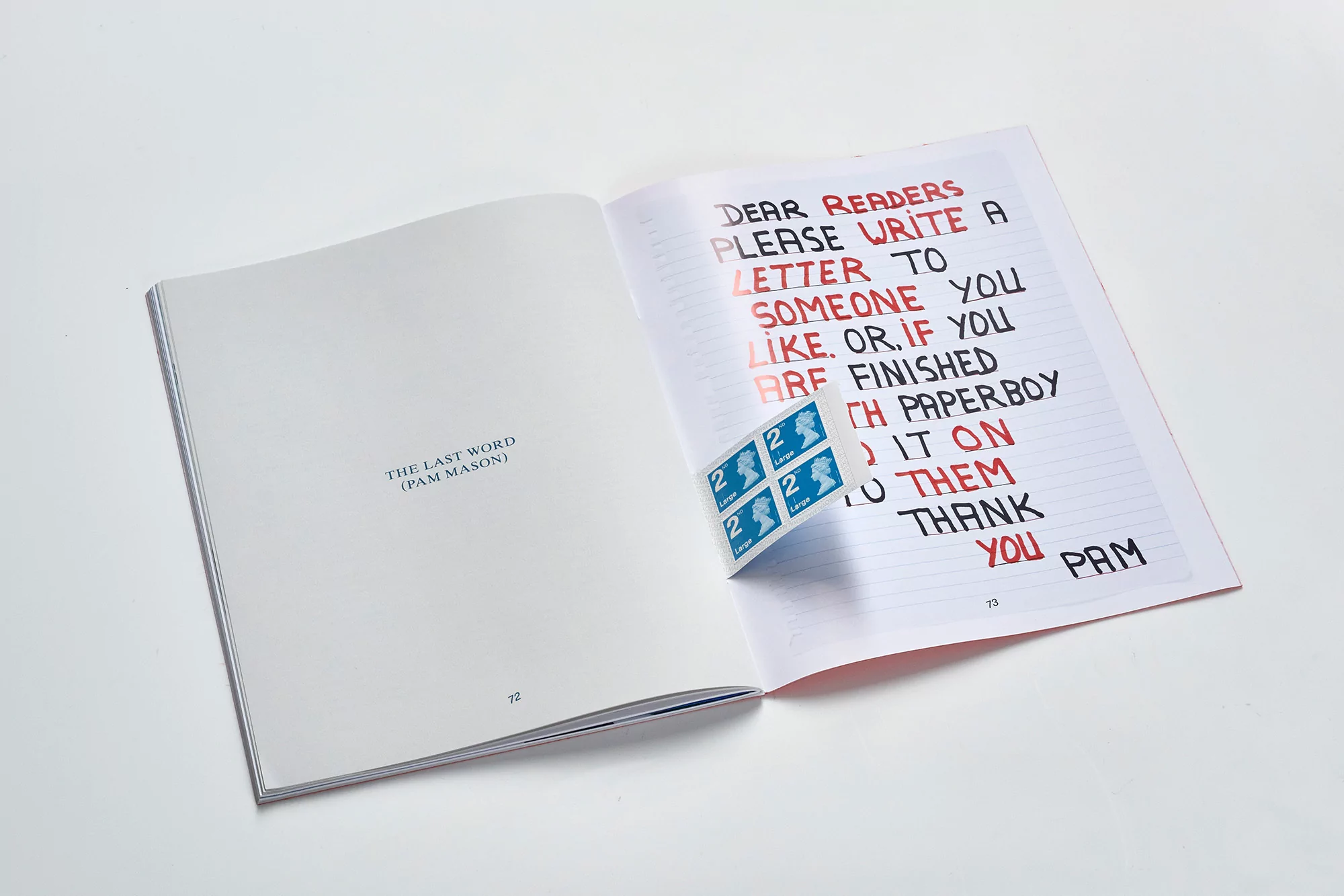 Open book with handwritten text 'Dear Readers, Please write a letter...' Stamps on page. White background and good studio lighting.