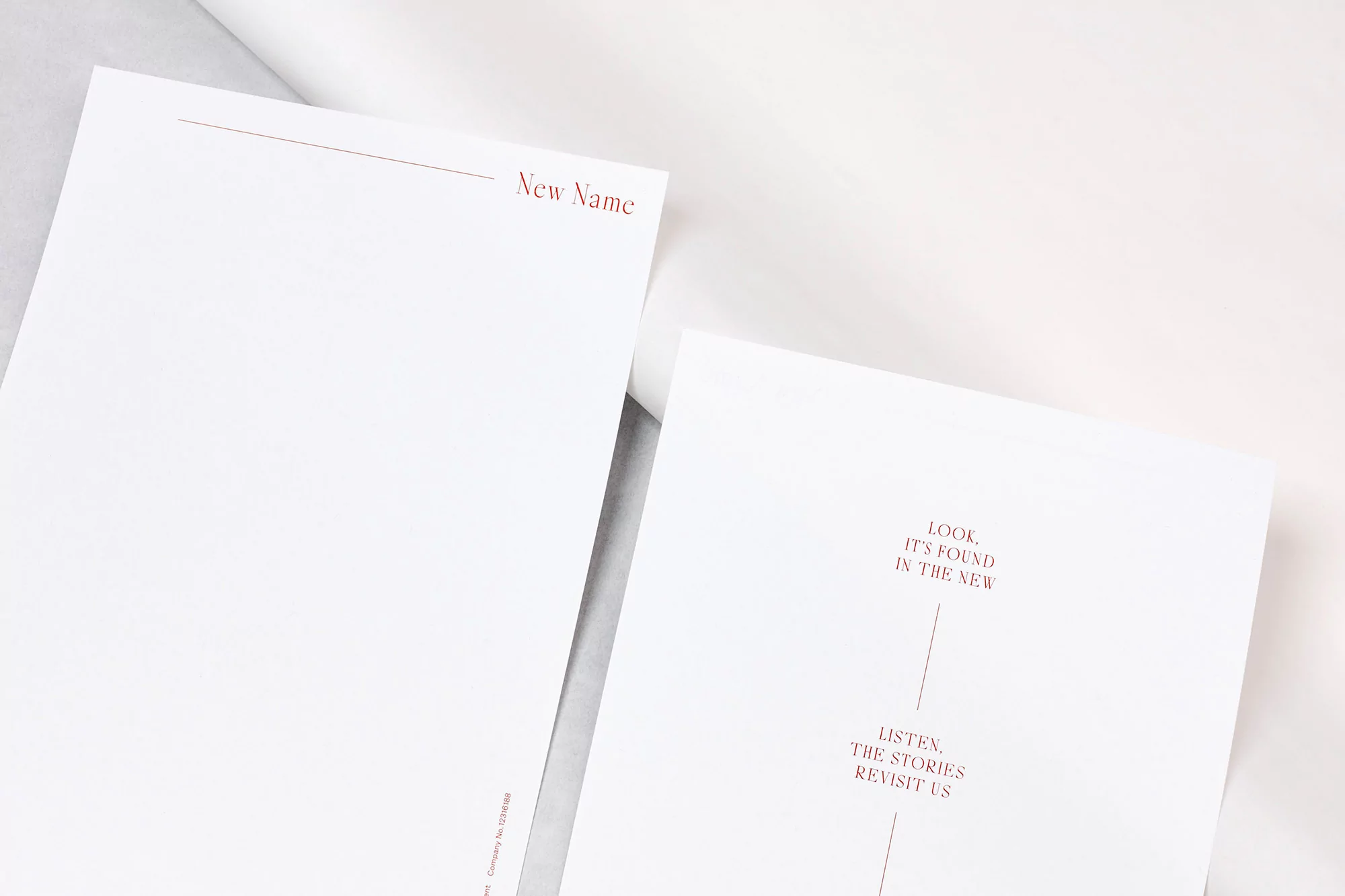 Two white papers with red-ink text. One says 'New Name.' The other reads: 'Look. It's found in the New. Listen. The stories revisit us.'