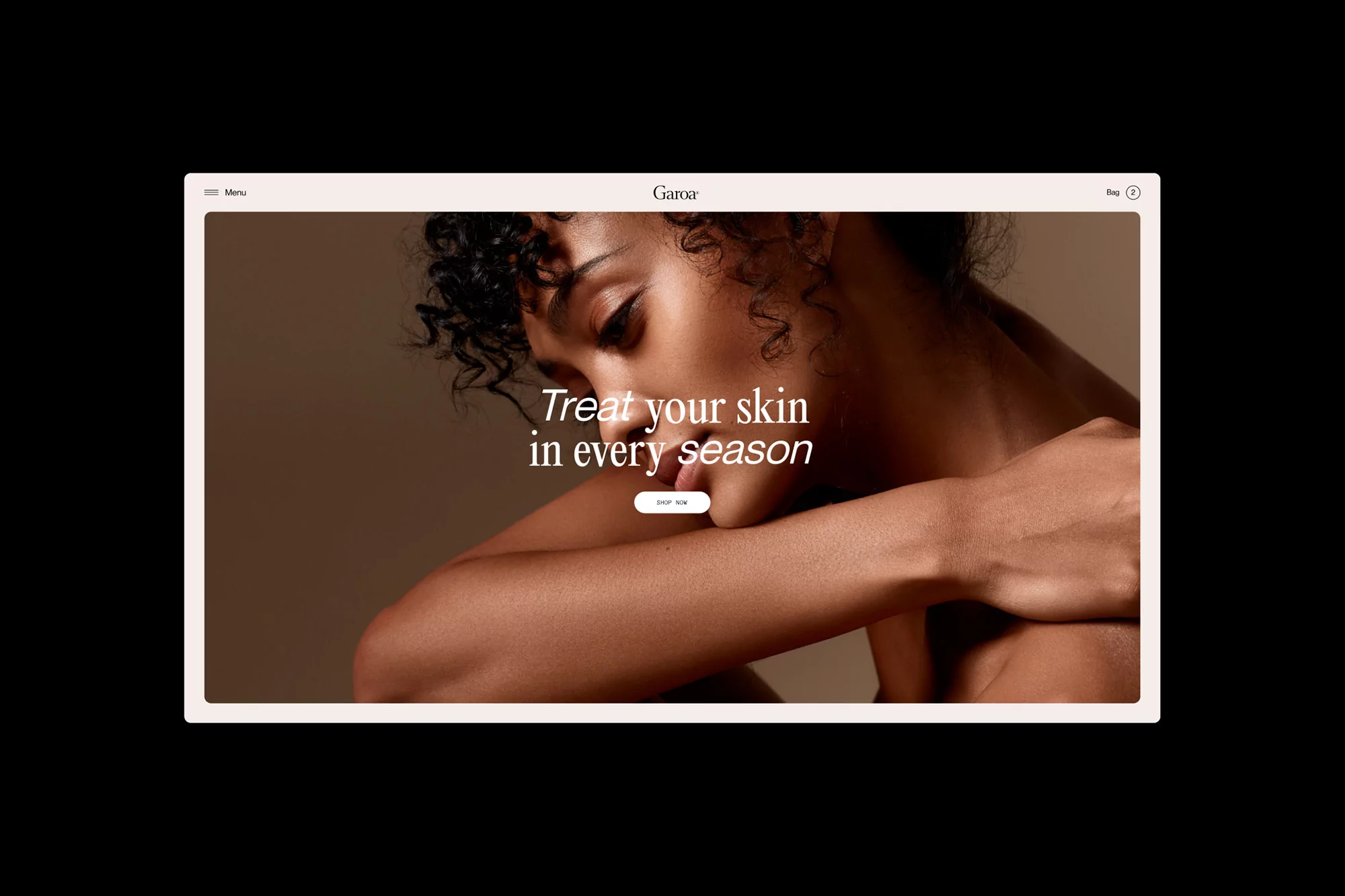 Tan-skinned woman with curly hair pictured in a beauty advertisement, featuring a website interface promoting skincare products. 