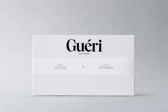 White Gueri skincare box featuring black logo and text descriptions against a neutral background, clean product shot.