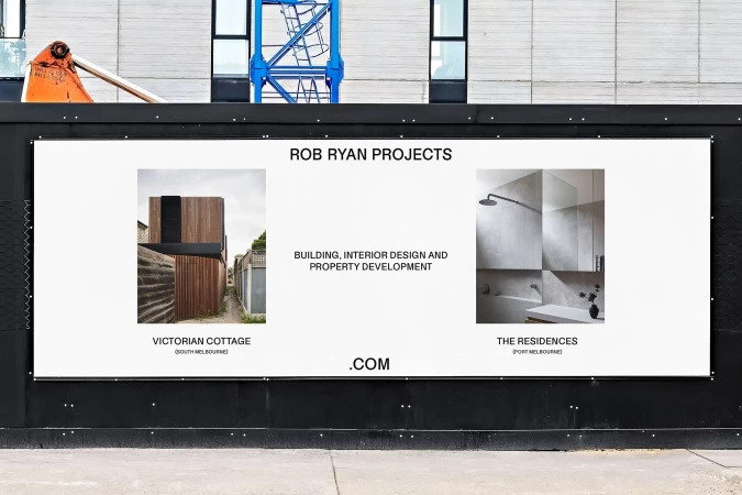 Outdoor advertising billboard showcasing architectural and interior design projects, promoting Rob Ryan Projects with minimalist aesthetic.