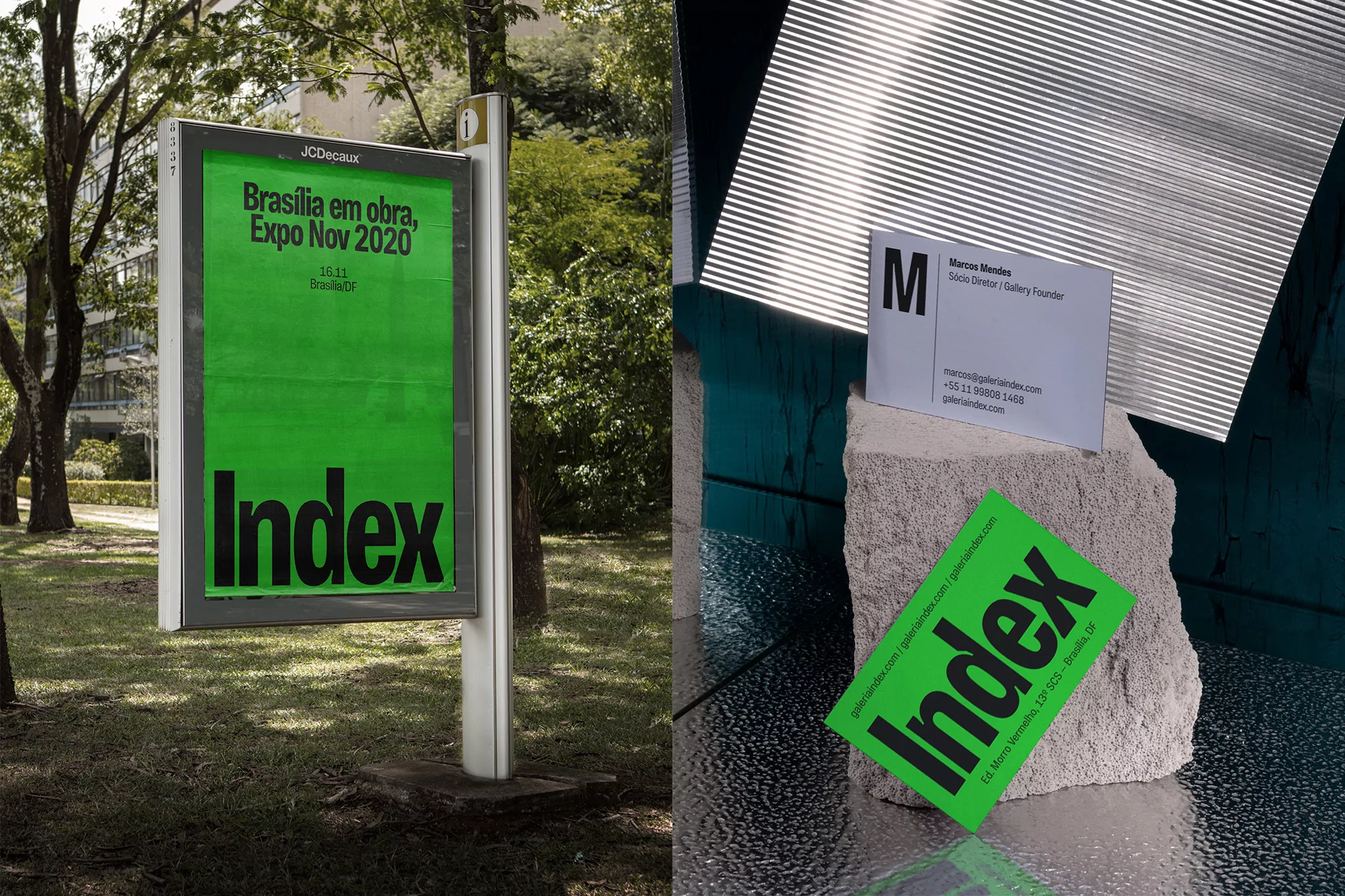 Outdoor advertising featuring 'Index' event poster with modern business card on stone, against corrugated metal backdrop in daytime.