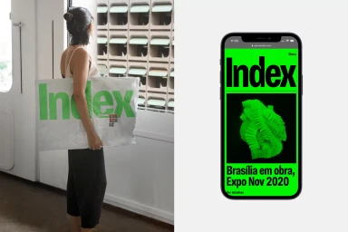 Woman carrying a white package with green Index logo next to a phone displaying a green website design