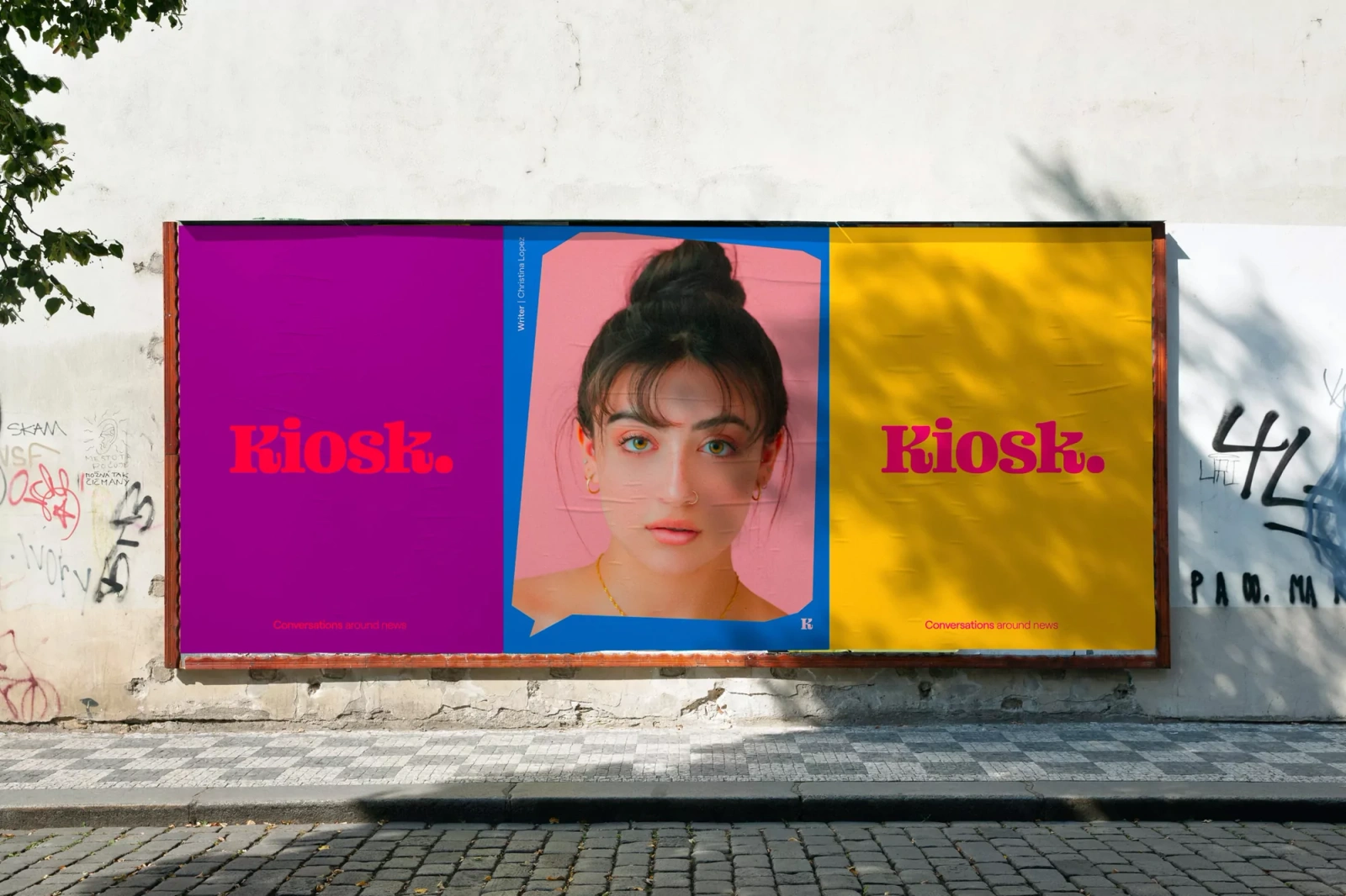 Billboard displaying KIOSK brand identity featuring bold typography and portrait photography on a weathered urban wall.