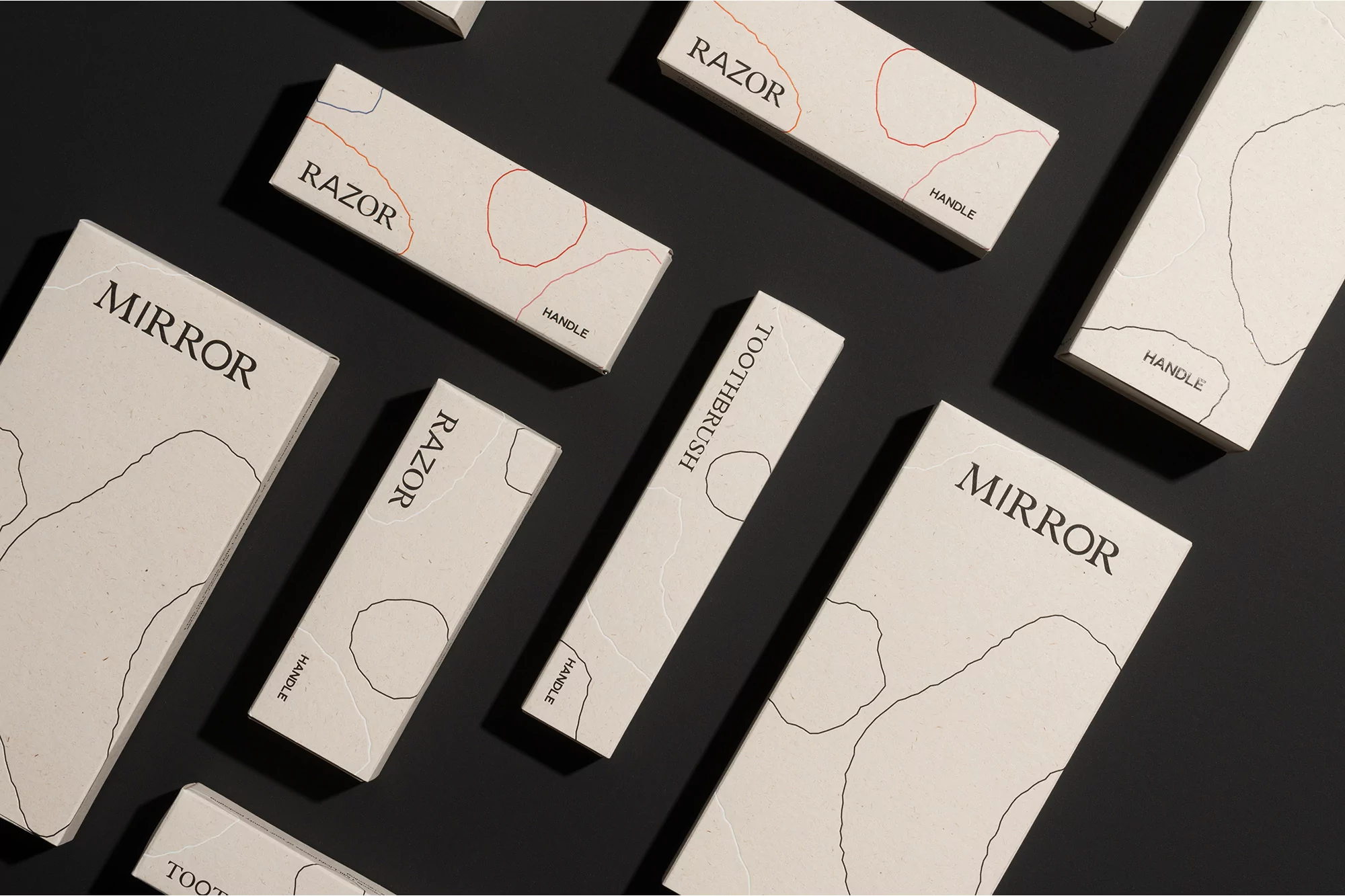 Minimalist product packaging featuring a mirror, razor, and toothbrush against a dark background, emphasizing modern design and clean aesthetics.