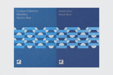 Arjowiggins paper sample showcasing Curious Collection Metallics Electric Blue and Keaykolour Royal Blue with geometric patterns