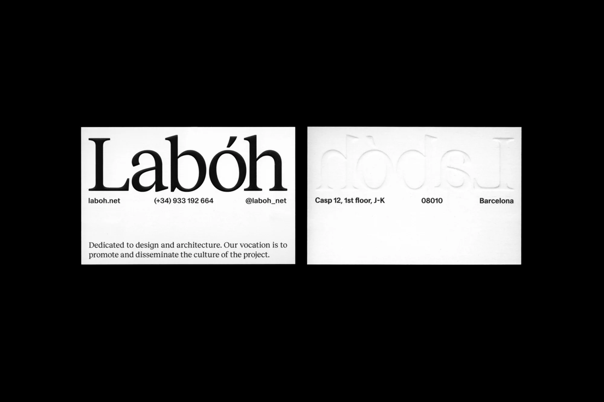 Close-up of a business card with 'Labóh' in bold black letters, contact details, and architectural focus statement against a stark white backdrop.