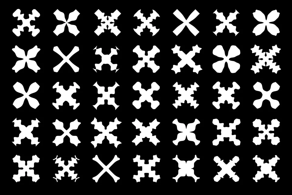 Graphic pattern of white crosses in multiple variations arranged against a black background, creating a repeating, decorative design.