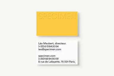 Two business cards for Figment, featuring one yellow card with embossed text and one white card with black contact typography