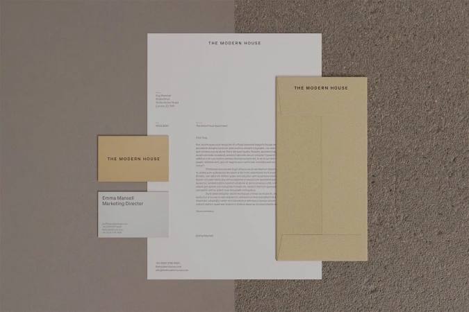 Stationery mockup featuring letterhead, envelope, business cards, and textured grey background with the brand name 'The Modern House'.