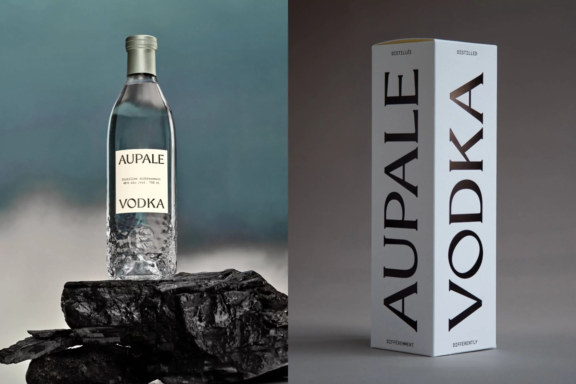 Bottle of Aupale Vodka displayed on black stone next to a white product box. Minimalist presentation with a clean, modern aesthetic.