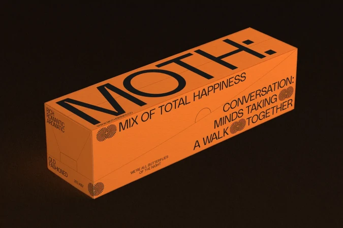 Eye-level studio shot of an orange rectangular box with black typography featuring words such as MOTH:, Happiness, and Conversation.