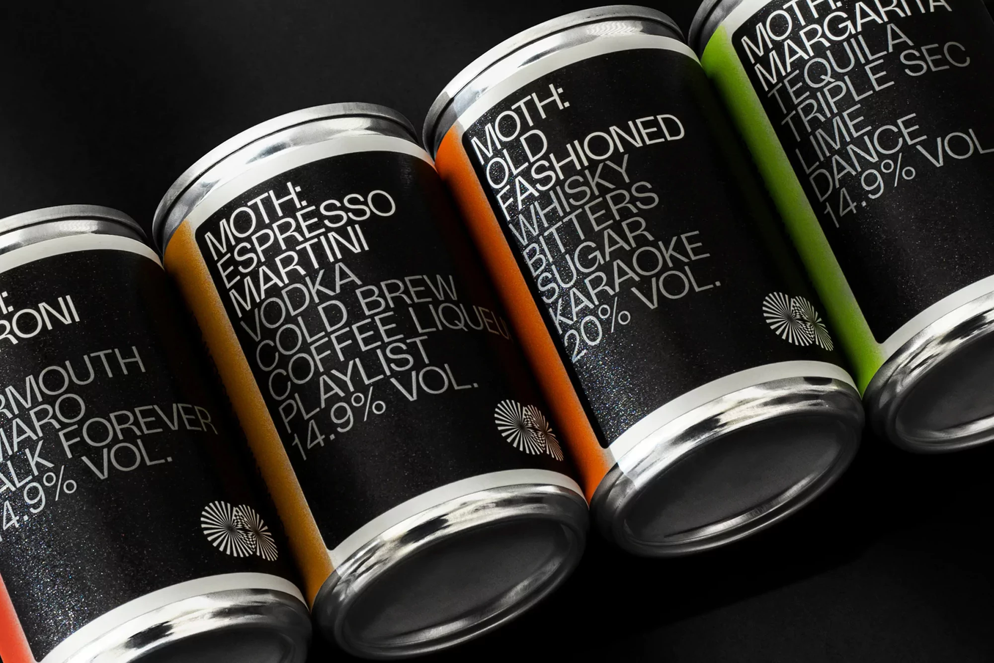 Four sleek cans of MOTH cocktails are arranged in a close-up shot. Each can features a minimalist black label with white text.