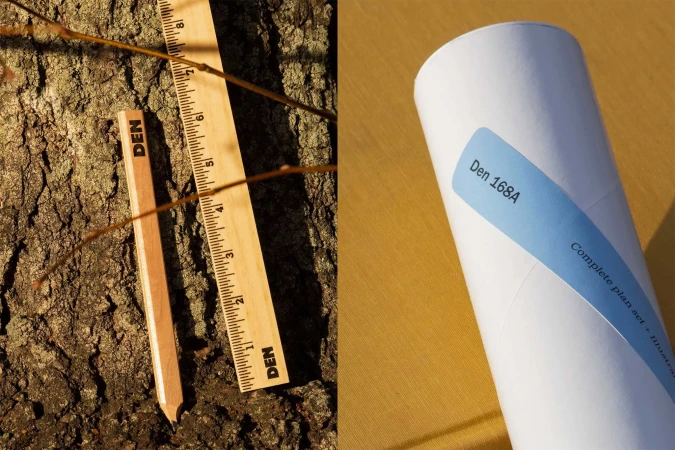 Close-up of two wooden rulers and a white tube with a blue label against a tree bark background, highlighting measurement tools.