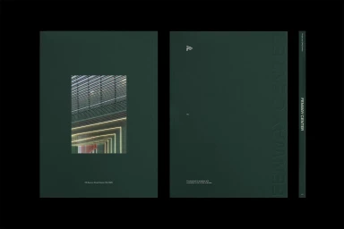 Dark green brand identity brochure cover featuring an architectural cutout window and debossed typography