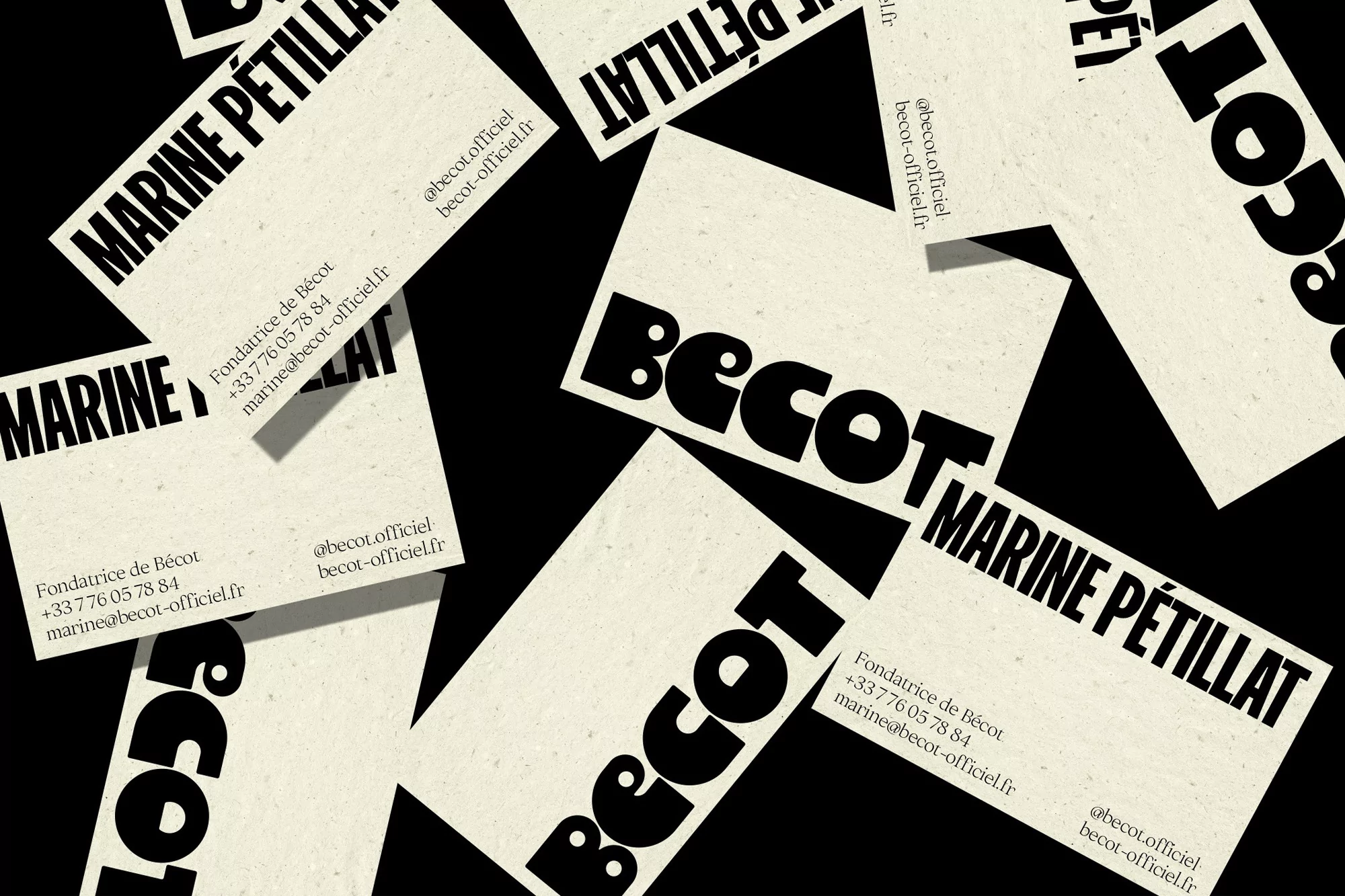 Scattered business cards with bold typography and contact information against a solid black background, for professional networking.