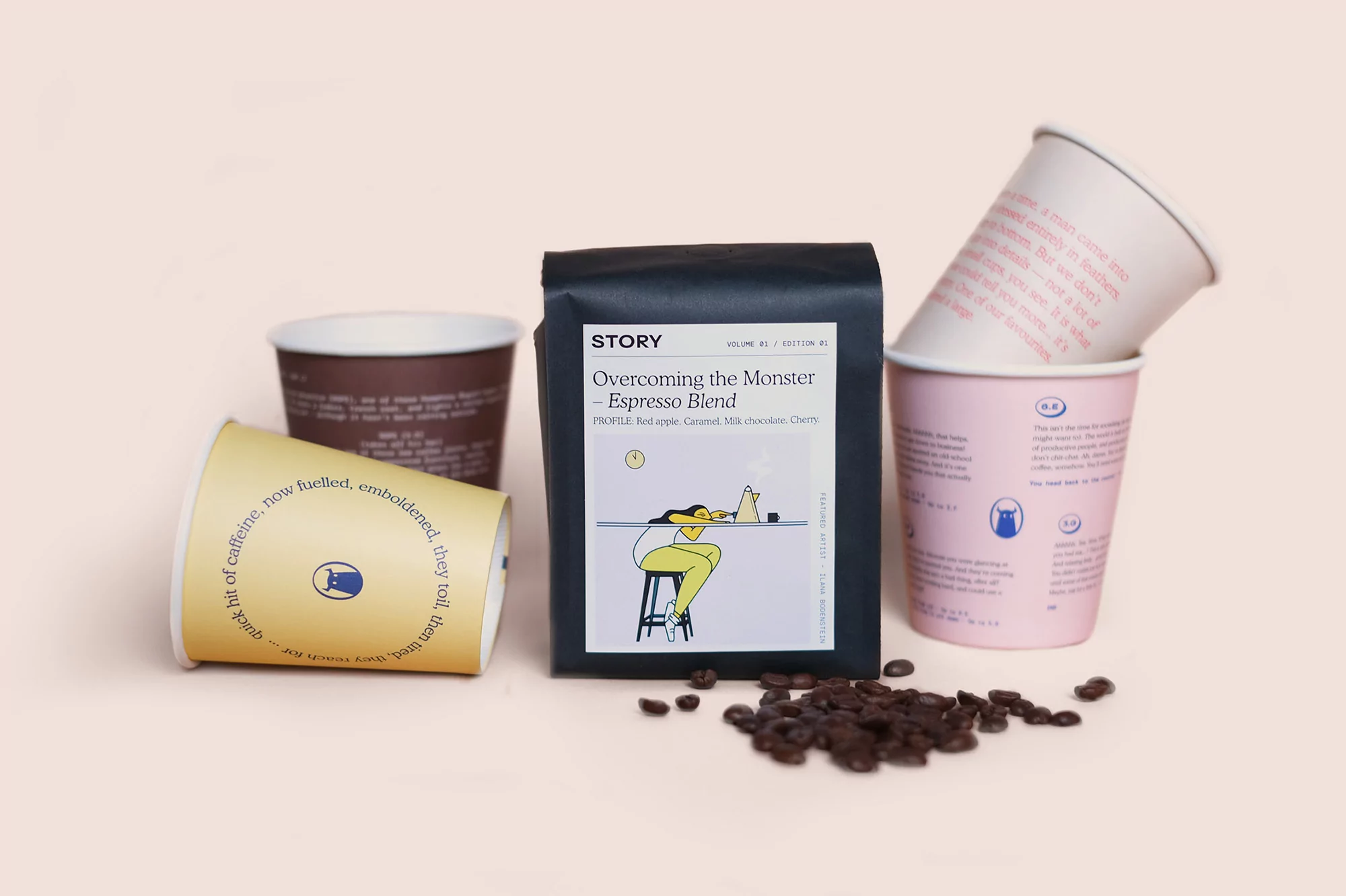 Coffee beans spilled near a Story brand espresso blend bag and cups in a studio, showcasing a cafe aesthetic.