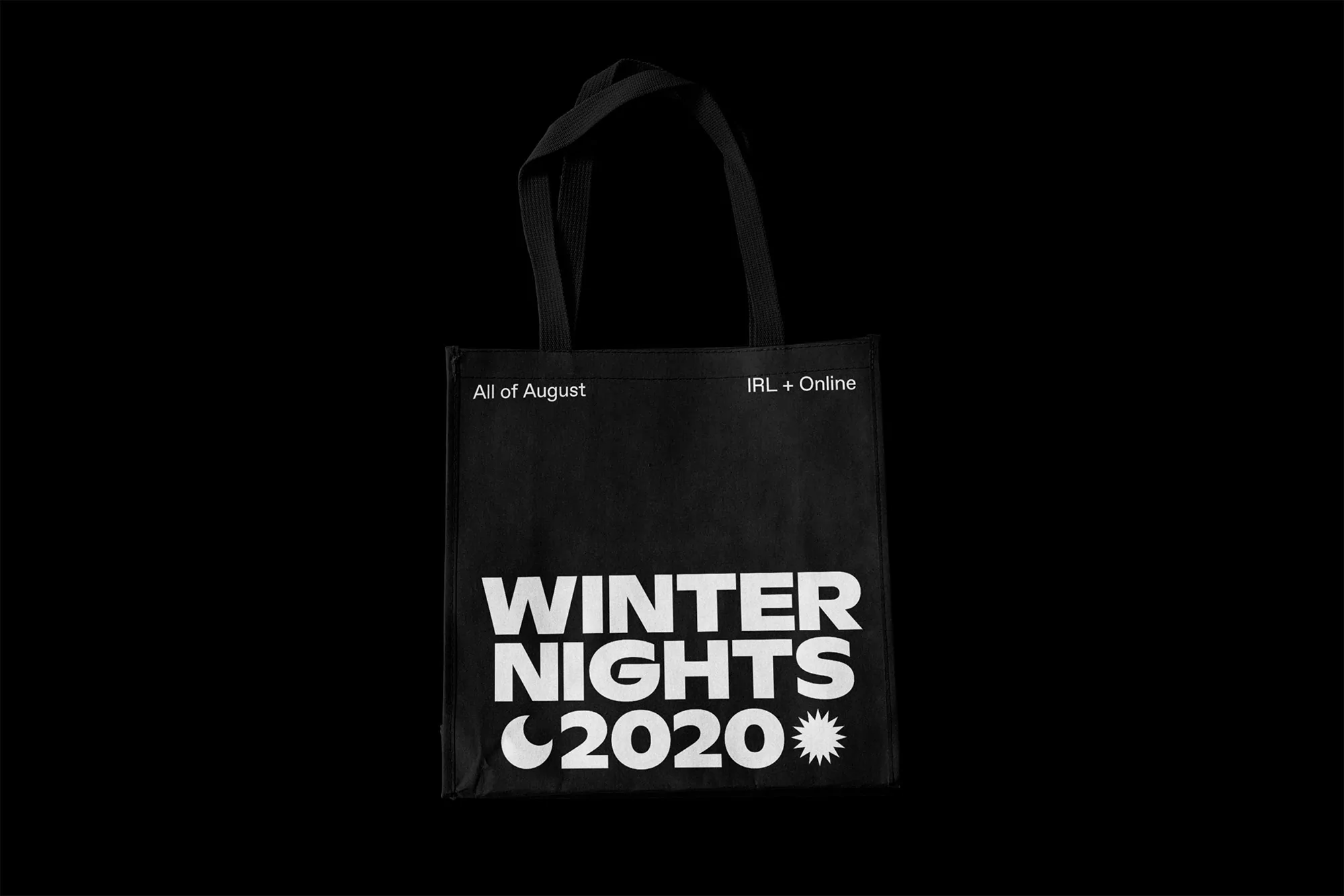 Black tote bag features 'Winter Nights 2020' text, with crescent moon and star symbols, set against a dark background.