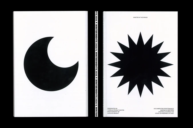 Monochromatic book cover with black crescent moon on one side and black sun burst on the other, set against a white background.