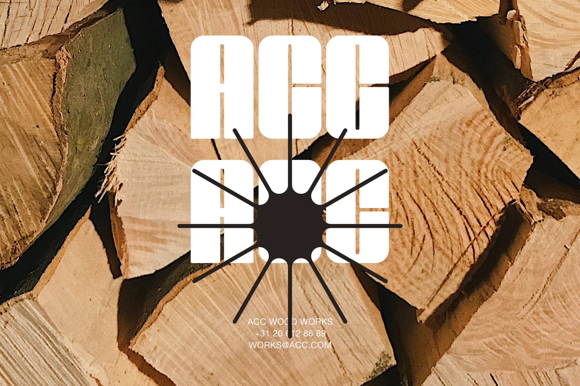 Stack of split firewood with a white graphic design of the company logo in the center of the frame, neutral tones.
