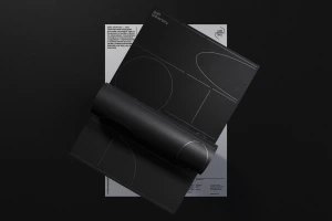 Black and white graphic design branding materials featuring minimalist typography and geometric lines.
