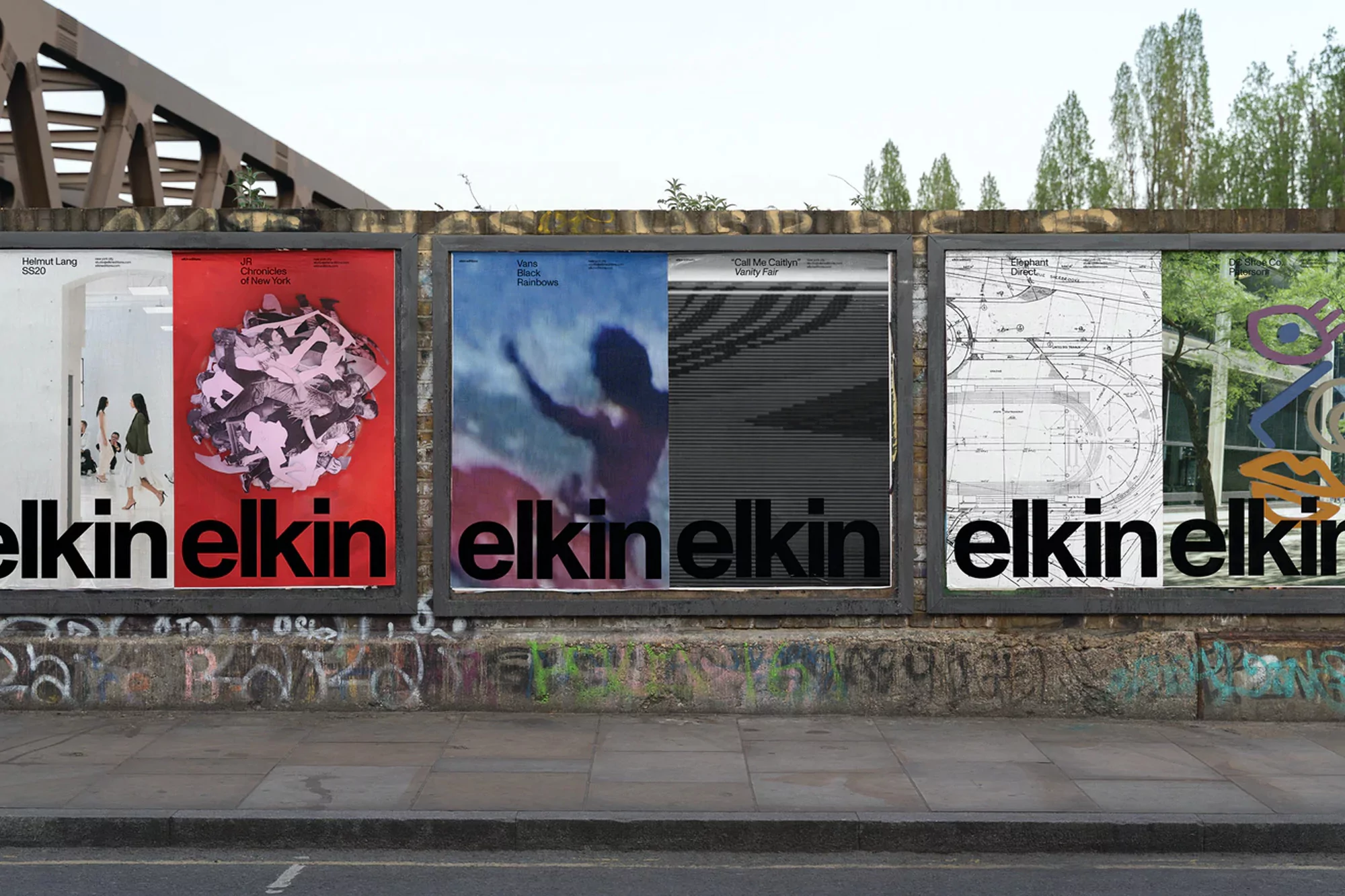 Outdoor view of a series of Elkin brand posters displayed on a textured brick wall next to a sidewalk, under a bridge.