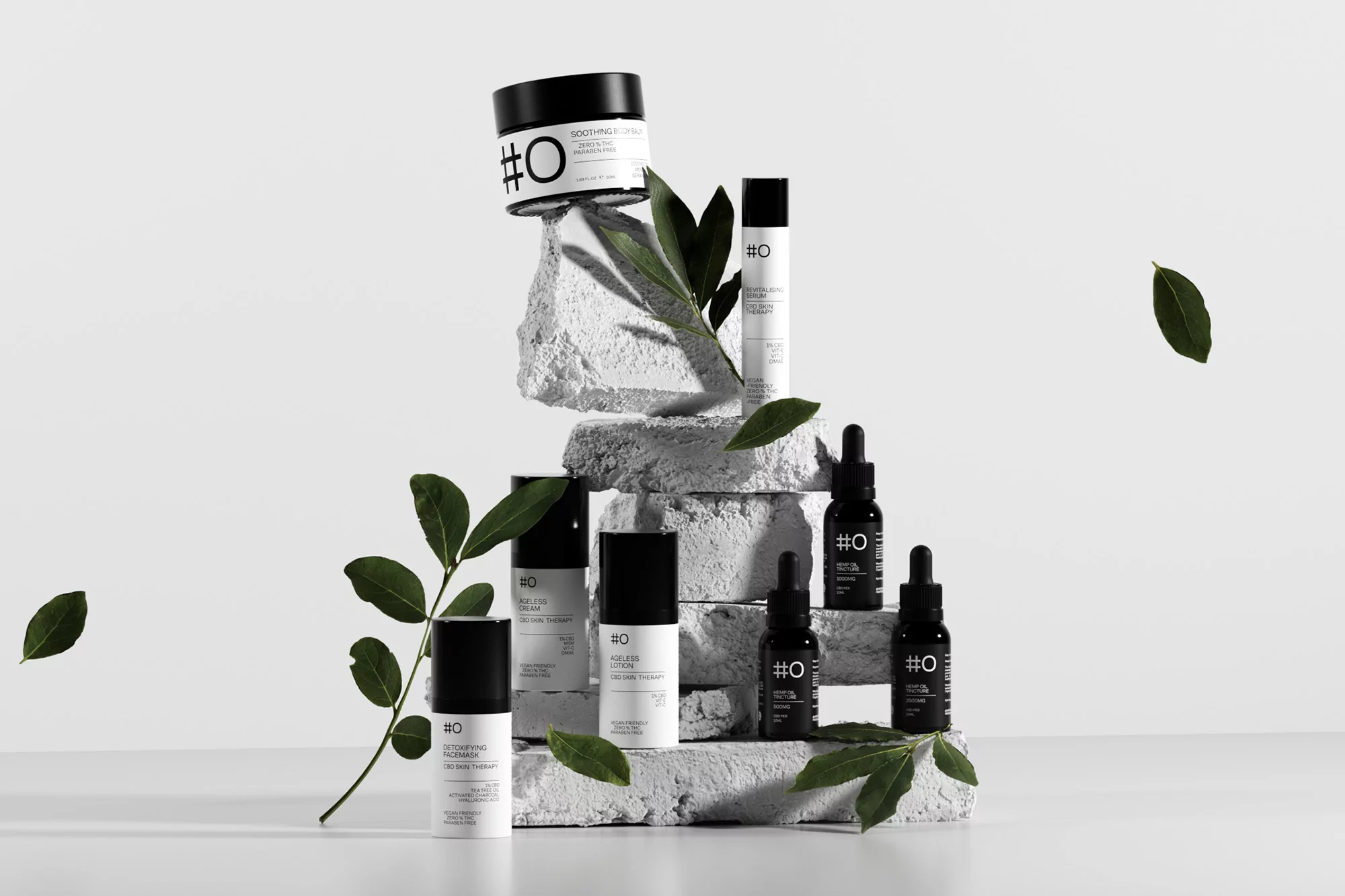 Elevated beauty product display with skincare bottles, jars, and dropper bottles arranged with greenery against a bright white background.