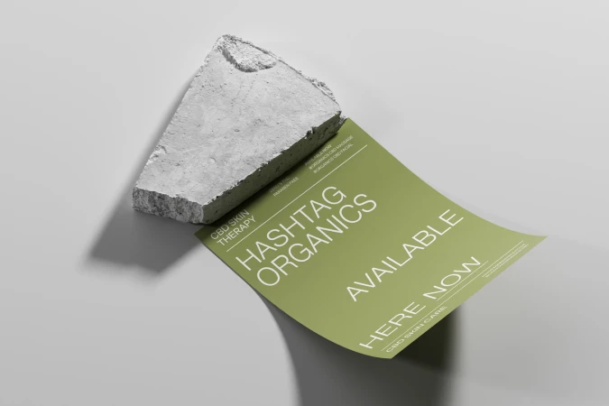 Studio shot of a green skincare advertisement featuring a piece of concrete for product promotion in a well-lit indoor environment.