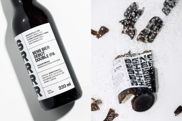 Bens Bier double IPA beer bottle and broken glass shards splashing on white